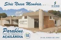 Arte com imagem de fundo da fachada da VT de Açailândia, com aplicação de filtro de aquarela. No topo, veem-se, à esquerda, o texto SÉRIE NOSSA MEMÓRIA... em azul escuro e, à direita, a logomarca do TRT-16, na versão colorida. Na base, veem-se, à esquerda, o texto 19 DE JUNHO DE 1993, e ainda, à direita, o selo de 31 anos e o texto PARABÉNS, VARA DO TRABALHO DE AÇAILÂNDIA, ambos os textos em azul escuro.