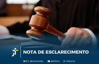 Arte feita com a imagem de uma mão segurando o martelo de juiz. Na parte inferior: NOTA DE ESCLARECIMENTO