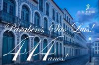 Arte feita com a imagem de casarões do centro histórico de São Luís. Ao centro  a mensagem: Parabéns São Luís 414 anos.