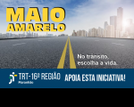 Fundo com paisagem de prédios. À frente, estrada feita de asfalto, com texto na cor amarela escrito MAIO AMARELO, e texto na cor branca escrito NO TRÂNSITO, ESCOLHA A VIDA. À baixo, Abaixo, tarja com a logotipo do TRT-16 e texto de apoio à iniciativa da campanha. 