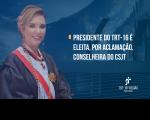Fundo azulado, com imagem de um prédio espelhado. À esquerda, imagem de uma mulher sorrindo. À direita, texto escrito Presidente do TRT-16 é eleita, por aclamação, conselheira do CSJT. No rodapé, do lado direito, logomarca do TRT-16.